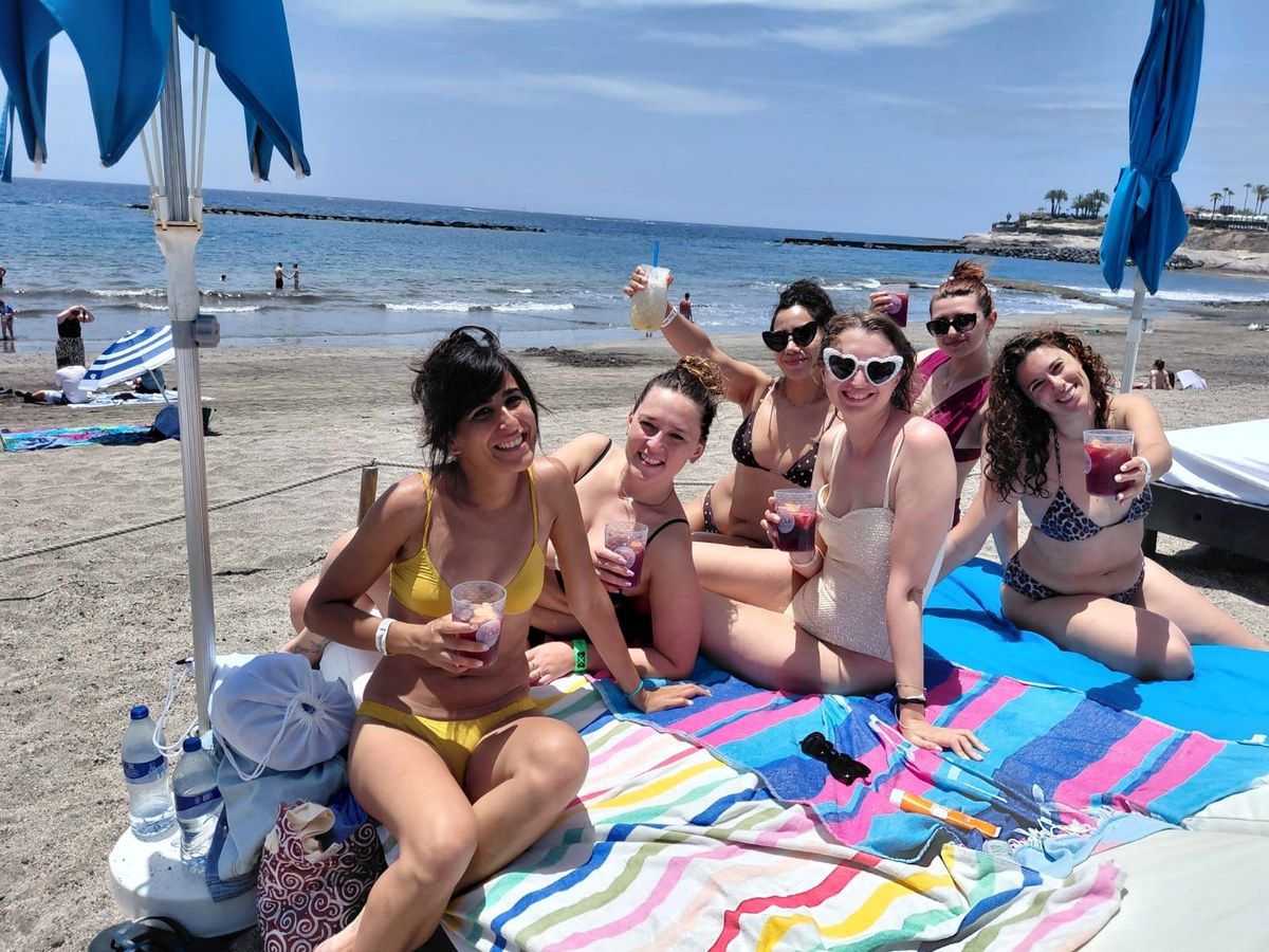 Bachelorette group relaxing on a beach in Tenerife